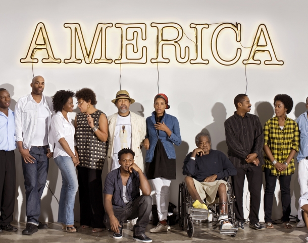 A group of 30 Americans artists, left to right: Rashid Johnson, Nick Cave, Kalup Linzy, Jeff Sonhouse, Lorna Simpson, Carrie Mae Weems, Barkley L. Hendricks, Hank Willis Thomas (front row), Xaviera Simmons, Purvis Young, John Bankston, Nina Chanel Abney, Henry Taylor, Mickalene Thomas (front row), Kerry James Marshall, and Shinique Smith.