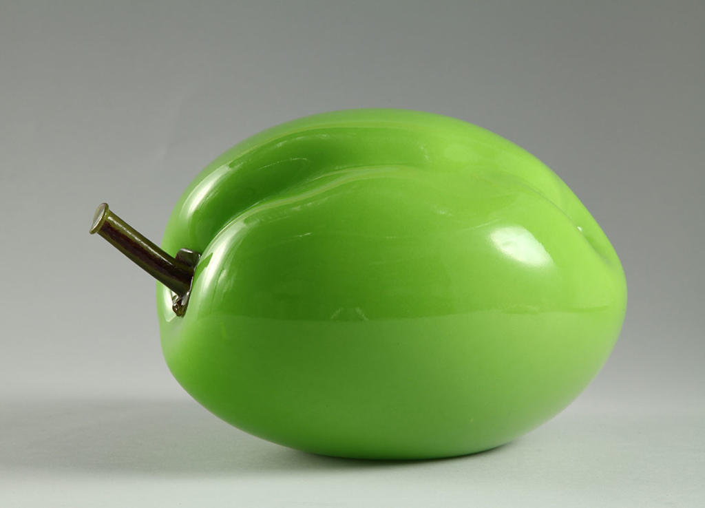 Bulbous, lime-green sculpture of a plum.