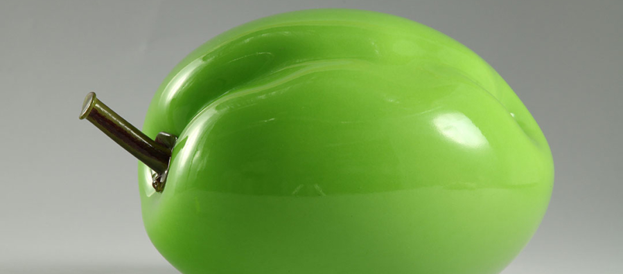 Bulbous, lime-green sculpture of a plum.