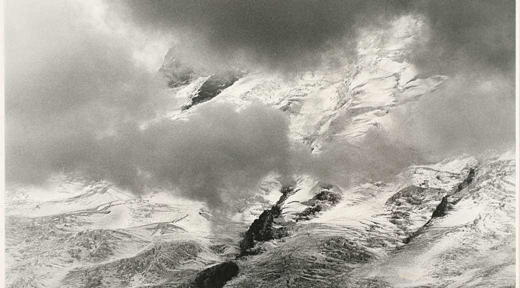 Photograph Credit Line: Museum purchase with funds from Nancy S. Nordhoff in honor of Mary Randlett Object number: 2008.8.20 DescriptionBlack and white photograph of snowy mountains seen through clouds.