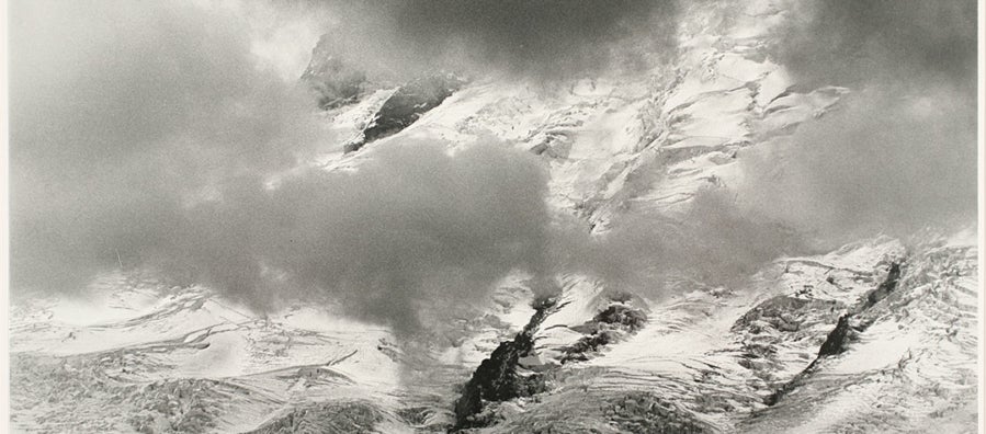Photograph Credit Line: Museum purchase with funds from Nancy S. Nordhoff in honor of Mary Randlett Object number: 2008.8.20 DescriptionBlack and white photograph of snowy mountains seen through clouds.