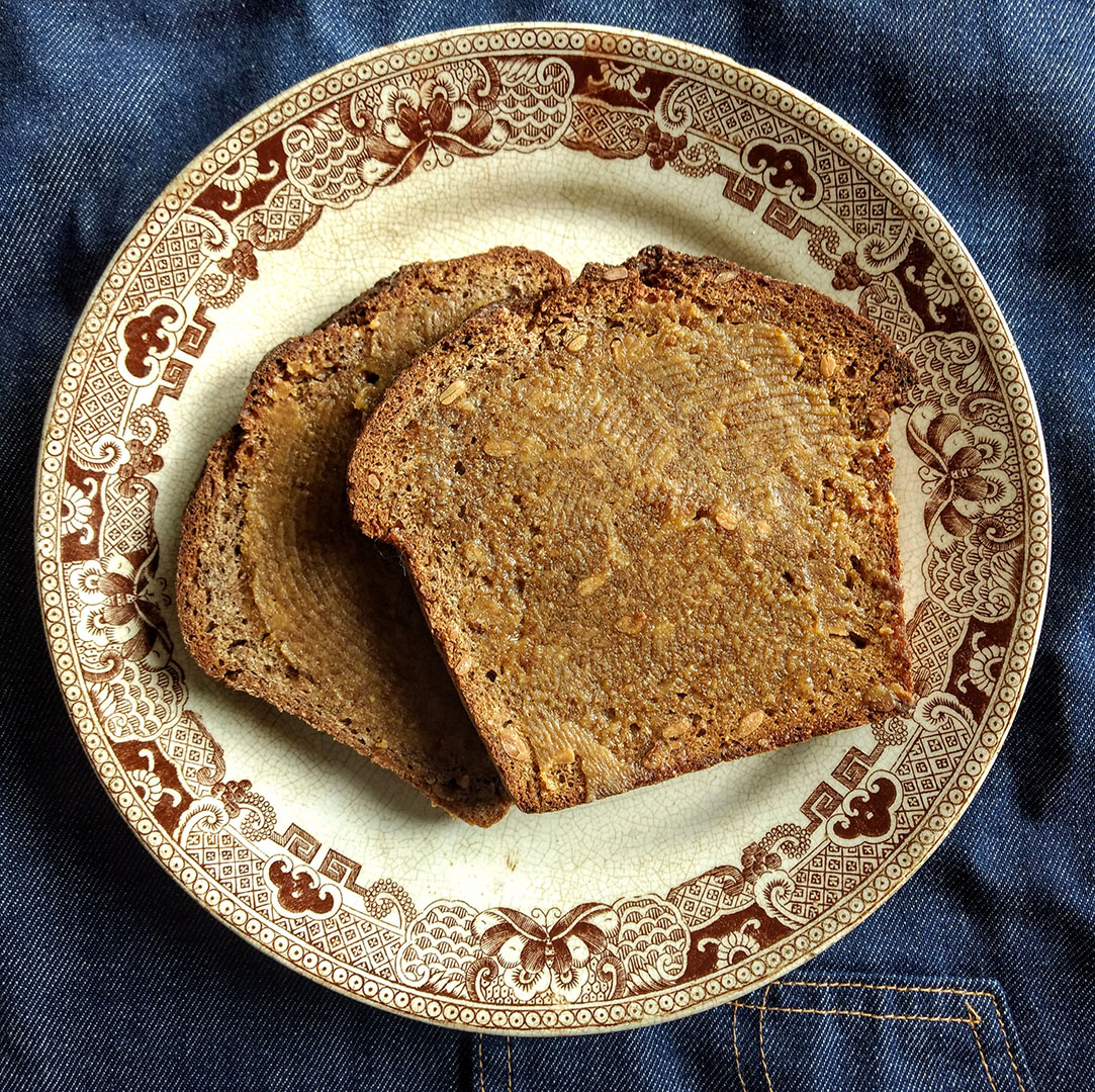  Two pieces of toast on a vintage plate.