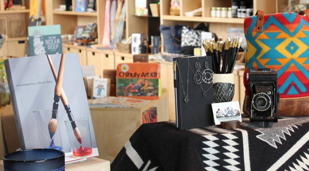 Interior of the TAM Store featuring books and other merchandise for sale.