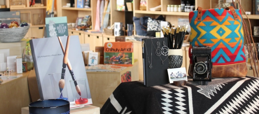 Interior of the TAM Store featuring books and other merchandise for sale.