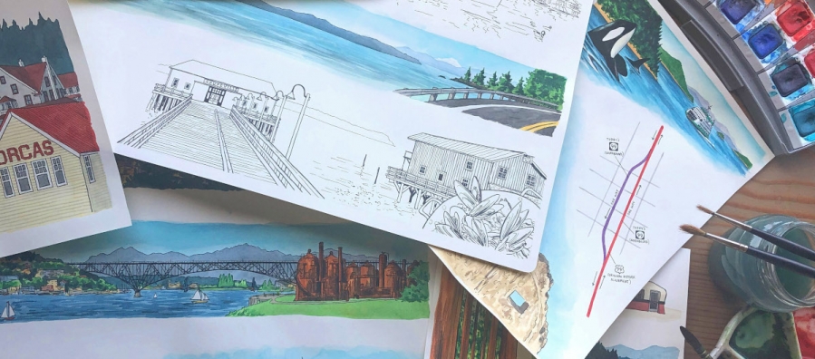 Photo of various hand-drawn and watercolor illustrations accompanied by brushes and palettes of paint