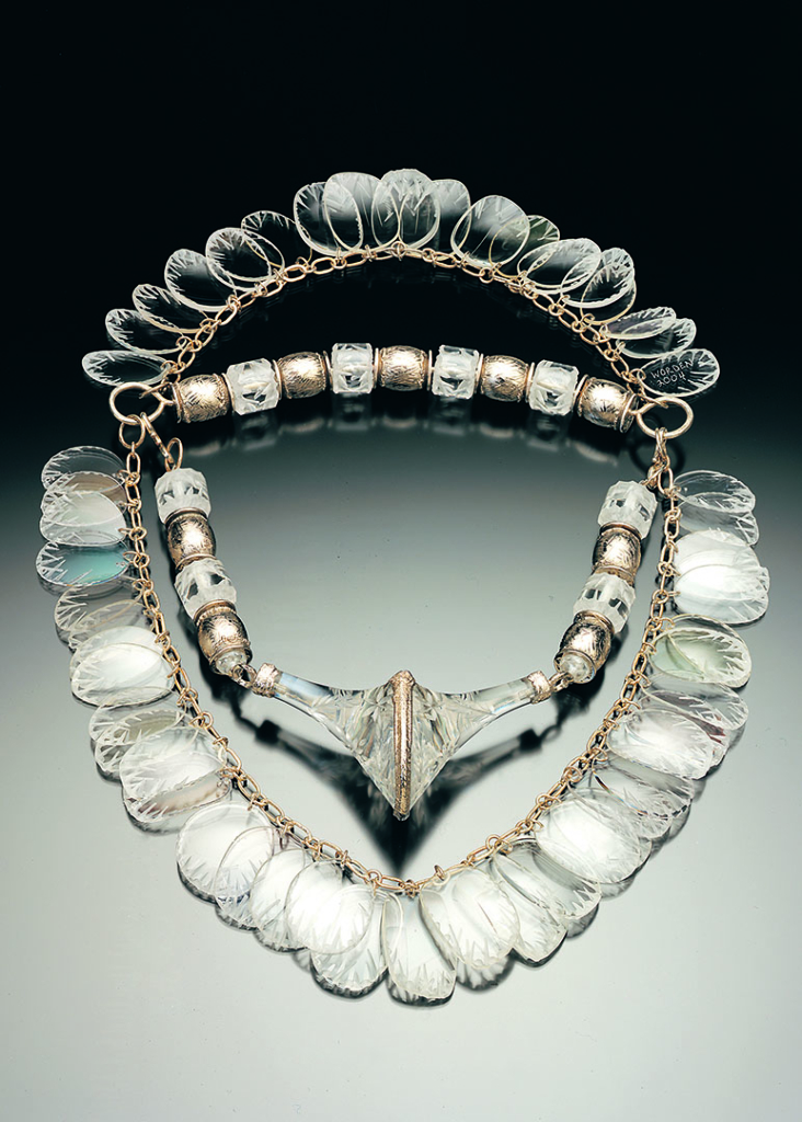 A necklace made from a circle of eyeglass lenses that have a crystal or ice-like appearance.