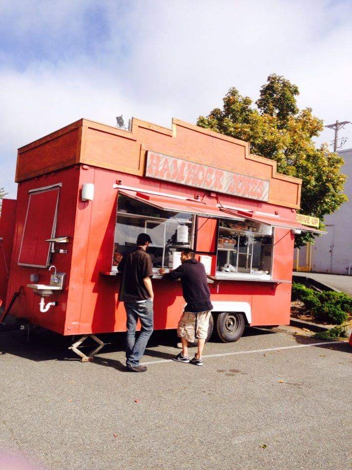 Color photo of HamHock Jones food truck parked in a parking lot and set up for customers.