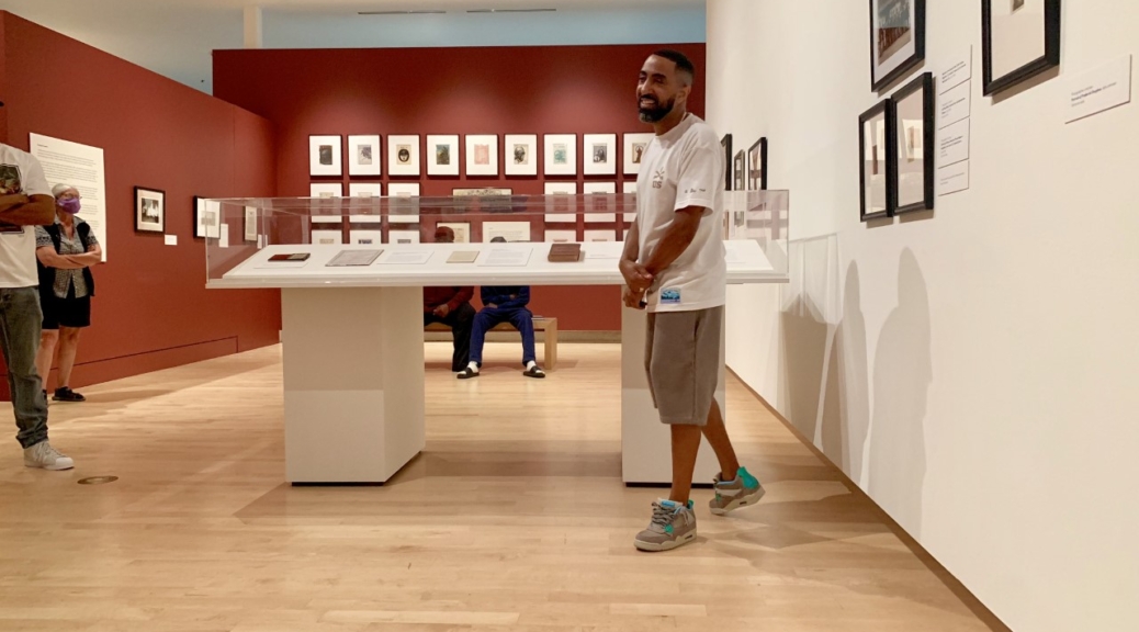 Photo of curator Khalil Kinsey in the Kinsey Collection gallery space.