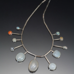 Color photo of opal necklace by artist Ruth Penington