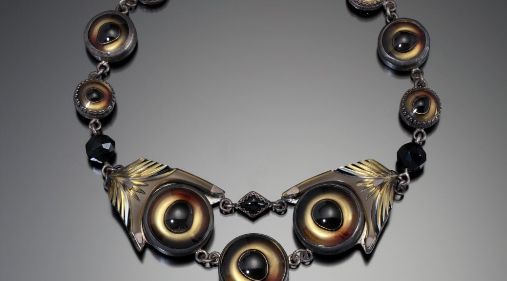 Color photo of Nancy Worden's jewelry piece, "Look Out."