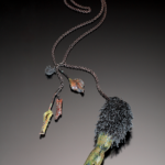 Color photo of "Turning" necklace by artist Maria Phillips