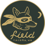 Logo for Field Bar and Bottle Shop. A tan line drawing of a fox wearing a bandana is placed on an olive green circle. Below the fox reads Field Tacoma, WA