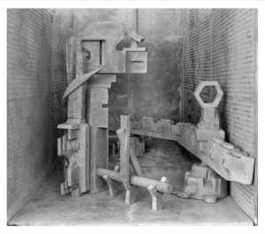 Black and white photograph of industrial equipment placed in a box by artist Rodrigo Valenzuela