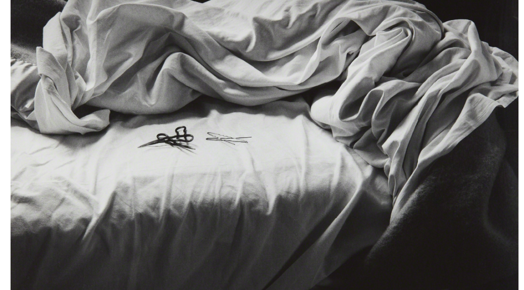 Black and white photograph of an unmade bed by artist Imogen Cunningham