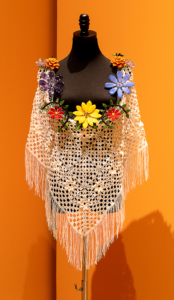 Color photograph of "Folklorico" glass and textile piece by GATHER artist Luis Sanchez (with Edelmira Jimenez Gallegos).