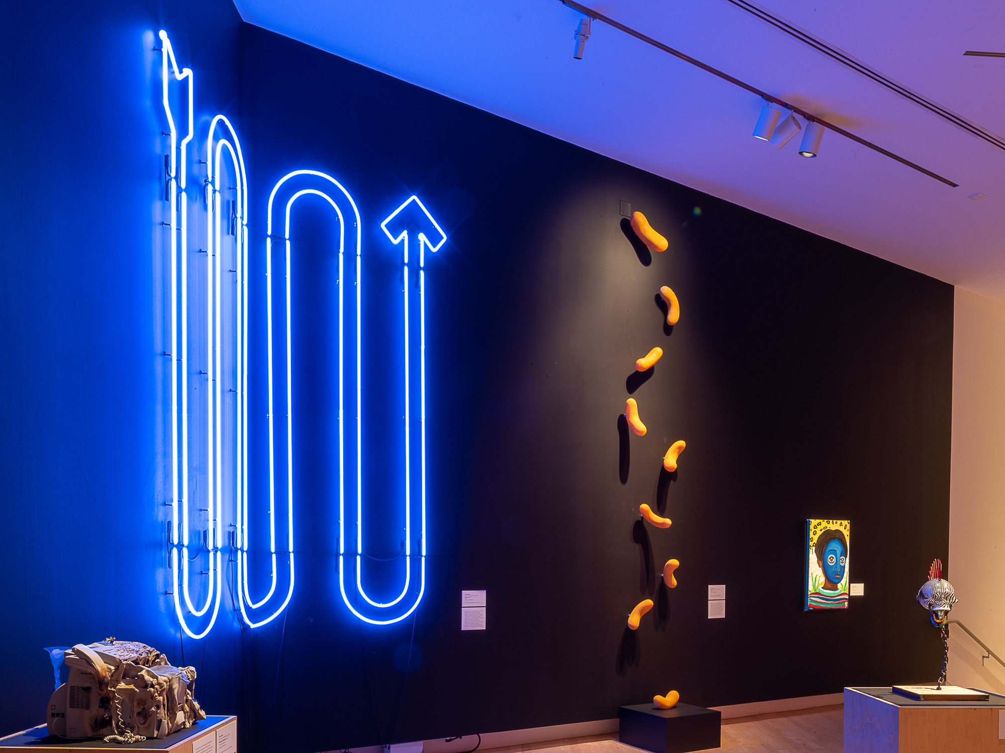 Color photo of "Going Up" neon piece by GATHER artist, Jacob Willcox