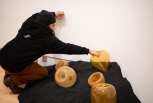 "Momentum" artist Trenton Quiocho installs "Trapped" 9