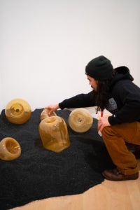 "Momentum" artist Trenton Quiocho installs "Trapped" 1